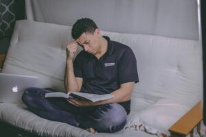 Boy studying for exam with full focus.